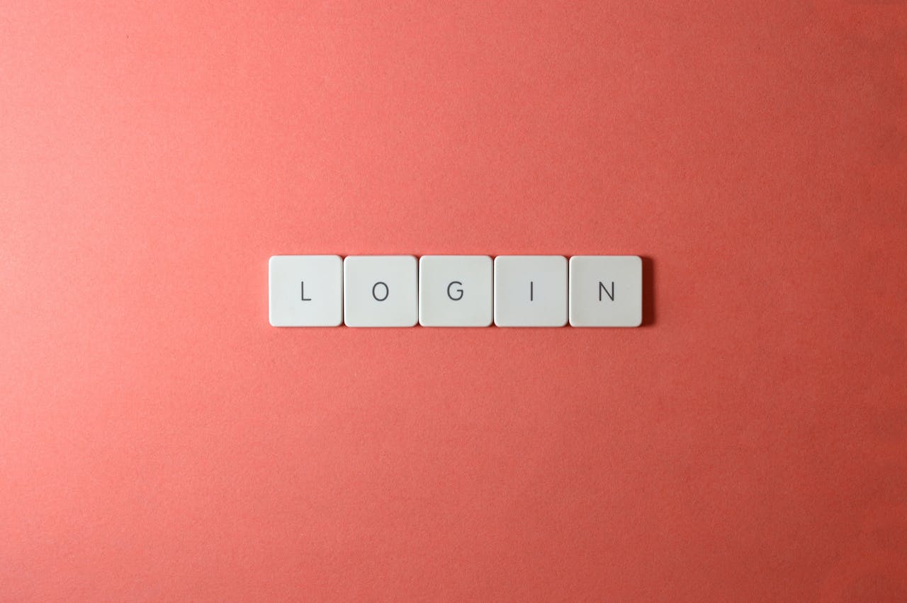 Close-up of login keyboard tiles on a coral background, perfect for tech themes.